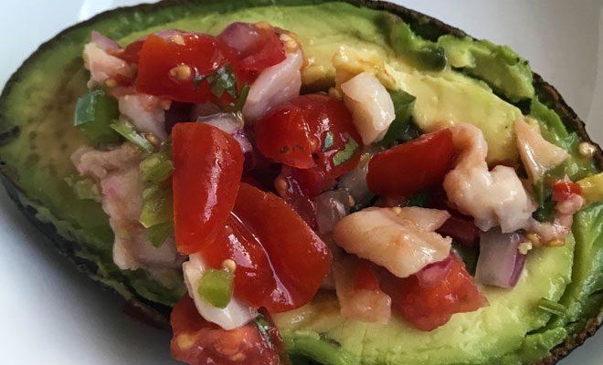 clam ceviche served with avocado