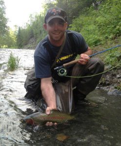 man holding rainbow trout on Kenai River